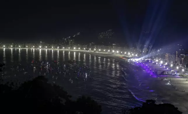 Boats sit idle off Copacabana beach as fans watch Madonna's final show of her The Celebration Tour in Rio de Janeiro, Brazil, on Saturday, May 4, 2024 (AP Photo/Bruna Prado)