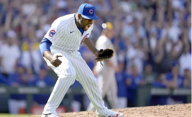 Chicago Cubs relief pitcher Héctor Neris celebrates after the last out of the team's 6-5 win over the Milwaukee Brewers in a baseball game Saturday, May 4, 2024, in Chicago. (AP Photo/Charles Rex Arbogast)