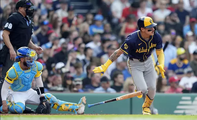 Milwaukee Brewers' Joey Ortiz runs on his two-run double in front of Boston Red Sox catcher Connor Wong during the third inning of a baseball game, Saturday, May 25, 2024, in Boston. (AP Photo/Michael Dwyer)