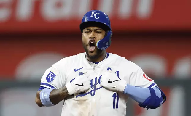 Kansas City Royals' Maikel Garcia reacts after hitting a two-run double during the seventh inning of a baseball game against the Milwaukee Brewers in Kansas City, Mo., Monday, May 6, 2024. (AP Photo/Colin E. Braley)