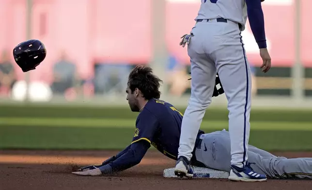 Milwaukee Brewers' Tyler Black beats the tag by Kansas City Royals second baseman Michael Massey to steal second during the first inning of a baseball game Tuesday, May 7, 2024, in Kansas City, Mo. (AP Photo/Charlie Riedel)