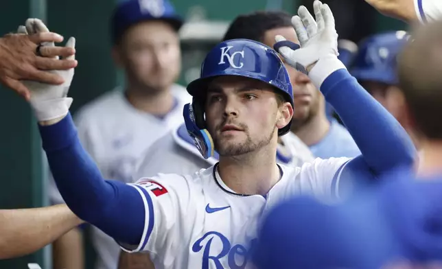 Kansas City Royals' Michael Massey celebrates in the dugout after hitting a home run during the seventh inning of a baseball game against the Milwaukee Brewers in Kansas City, Mo., Monday, May 6, 2024. (AP Photo/Colin E. Braley)