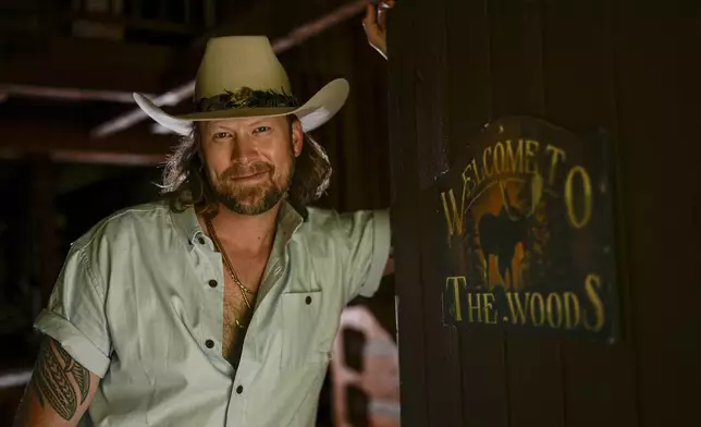 Brian Kelley poses for a portrait outside his cabin Wednesday, April 17, 2024, in Nashville, Tenn. (AP Photo/George Walker IV)