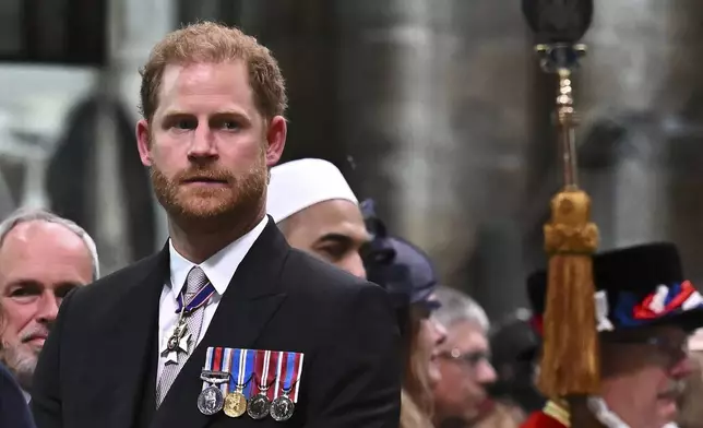 FILE -Britain's Prince Harry, Duke of Sussex looks on as Britain's King Charles III leaves Westminster Abbey after coronation in central London Saturday, May 6, 2023. (Ben Stansall/Pool photo via AP, FIle)