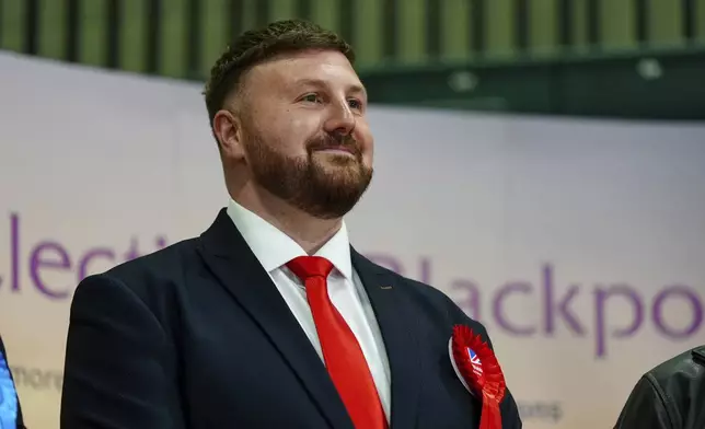 Labour candidate Chris Webb celebrates after winning the Blackpool South by-election following the count at Blackpool Sports Centre in Blackpool, Britain, Friday, May 3, 2024. (Peter Byrne/PA via AP)