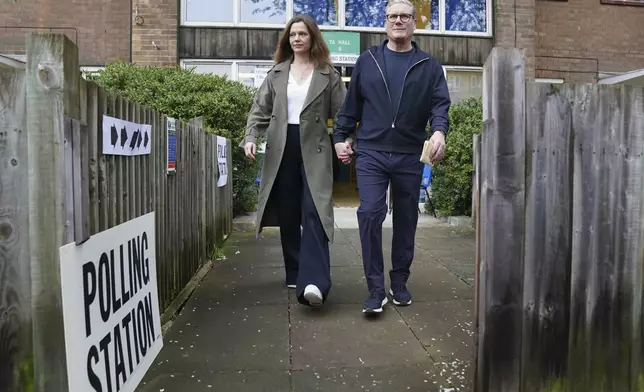 Britain's Labour leader Keir Starmer and his wife Victoria leave the polling station in his Holborn and St Pancras constituency, after casting their votes in the local and London Mayoral election, in north London, Thursday May 2, 2024. (Stefan Rousseau/PA via AP)