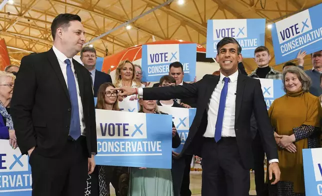 Conservative party candidate Lord Ben Houchen, left, with Britain's Prime Minister Rishi Sunak following his re-election as Tees Valley Mayor in Teesside, England, Friday May 3, 2024. (Owen Humphreys/PA via AP)