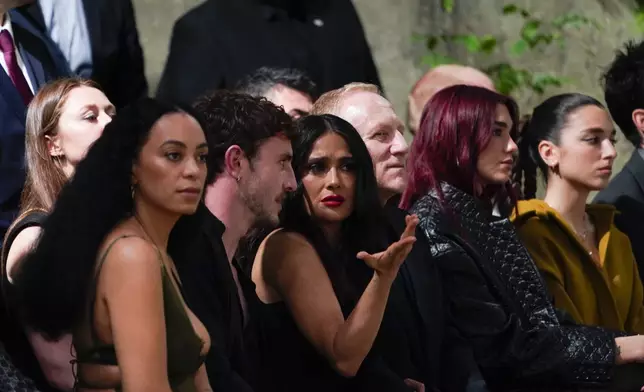 From second left, Paul Mescal, Selma Hayek, François-Henri Pinault and Dua Lipa attend the Gucci Cruise fashion show in London, Monday, May 13, 2024. (Photo by Alberto Pezzali/Invision/AP)