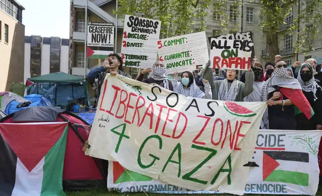 Pro-Palestinian students and demonstrators shout slogans at the campus of SOAS University of London as students occupy parts of university campus in London, Wednesday, May 8, 2024. (AP Photo/Kin Cheung)