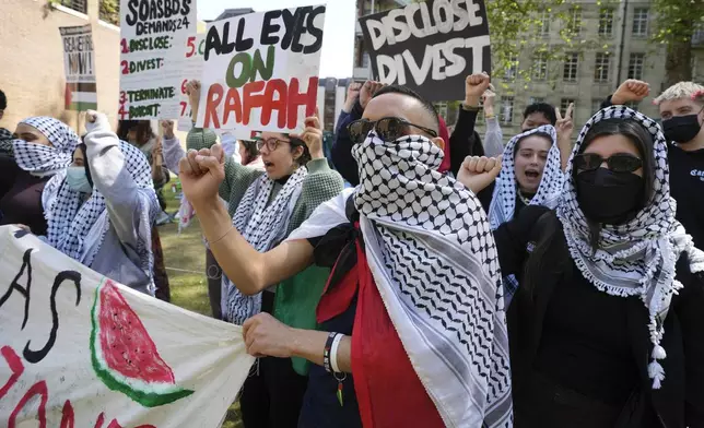 Pro-Palestinian students and demonstrators shout slogans at the campus of SOAS University of London as students occupy parts of university campus in London, Wednesday, May 8, 2024. (AP Photo/Kin Cheung)