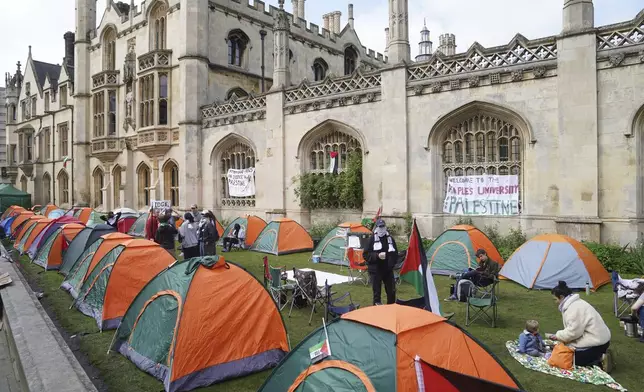 Students protest against the war in Gaza, at an encampment on the grounds of Cambridge University, England, Tuesday May 7, 2024. Students in the UK, including in Leeds, Newcastle and Bristol, have set up tents outside university buildings, replicating the nationwide campus demonstrations which began in the US last month. (Joe Giddens/PA via AP)