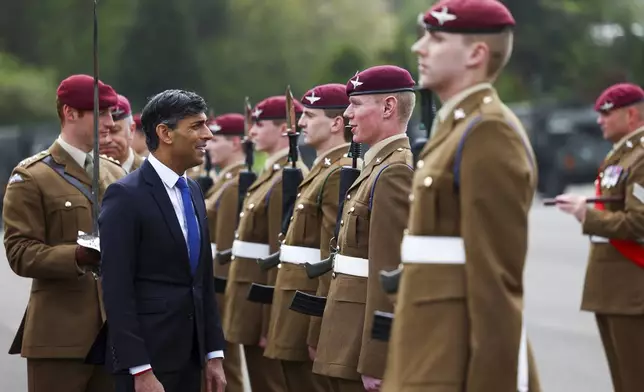 Britain's Prime Minister Rishi Sunak looks on as he inspects the Passing Out Parade of the Parachute Regiment recruits as he visits the Helles Barracks at the Catterick Garrison, a military base in North Yorkshire, Britain, Friday, May 3, 2024. (Molly Darlington/Pool photo via AP)