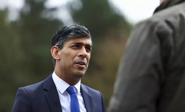 Britain's Prime Minister Rishi Sunak speaks as he takes part in broadcasting a clip during his visit to the Helles Barracks at the Catterick Garrison, a military base in North Yorkshire, Britain, Friday, May 3, 2024. (Molly Darlington/Pool photo via AP)