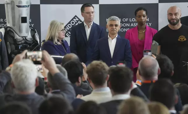 Labour's Sadiq Khan, centre, is re-elected as the Mayor of London, at City Hall, London, Saturday May 4, 2024. ( Jeff Moore//PA via AP)