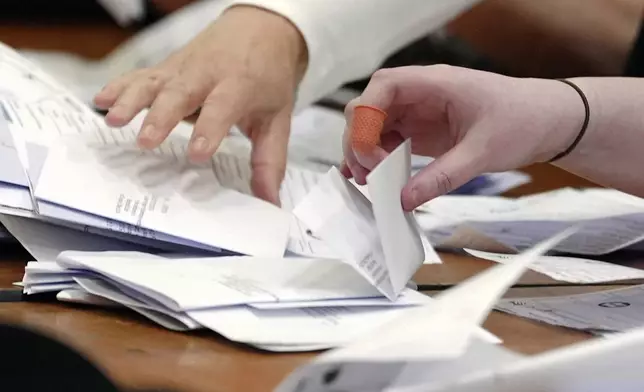 Counting begins at the Blackpool South by-election at Blackpool Sports Centre in Blackpool, England, Thursday, May 2, 2024. The by-election was triggered after the resignation of Scott Benton. (Peter Byrne/PA via AP)