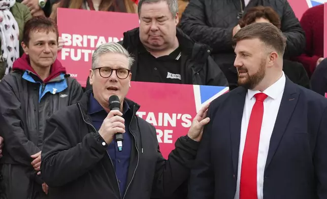 Newly elected British Labour MP Chris Webb, right, with Labour leader Sir Keir Starmer celebrating at Blackpool Cricket Club, England, Friday May 3, 2024 after being declared winner in the Blackpool South by-election. The by-election was triggered after the resignation of Scott Benton. (Peter Byrne/PA via AP)