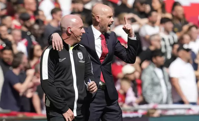 Manchester United's head coach Erik ten Hag, right, gestures during the English FA Cup final soccer match between Manchester City and Manchester United at Wembley Stadium in London, Saturday, May 25, 2024. (AP Photo/Kin Cheung)