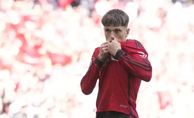 Manchester United's Alejandro Garnacho celebrates after scoring his side's opening goal during the English FA Cup final soccer match between Manchester City and Manchester United at Wembley Stadium in London, Saturday, May 25, 2024. (AP Photo/Kin Cheung)