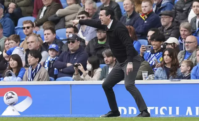 Aston Villa manager Unai Emery gestures on the touchline during the Premier League match between Brighton &amp; Hove Albion and Aston Villa, at the American Express Stadium in Brighton, England, Sunday May 5, 2024. (Gareth Fuller/PA via AP)
