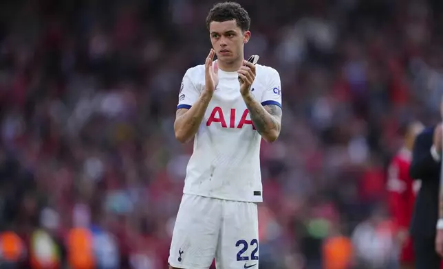 Tottenham's Brennan Johnson applauds supporters at the end of the English Premier League soccer match between Liverpool and Tottenham Hotspur at Anfield Stadium in Liverpool, England, Sunday, May 5, 2024. (AP Photo/Jon Super)