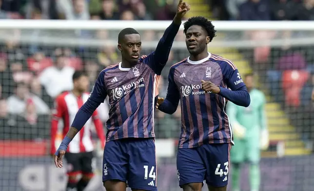 Nottingham Forest's Callum Hudson-Odoi, left, celebrates after scoring his side's first goal of the game, during the English Premier League soccer match between Sheffield United and Nottingham Forest, at Bramall Lane, in Sheffield, England, Saturday May 4, 2024. (Danny Lawson/PA via AP)