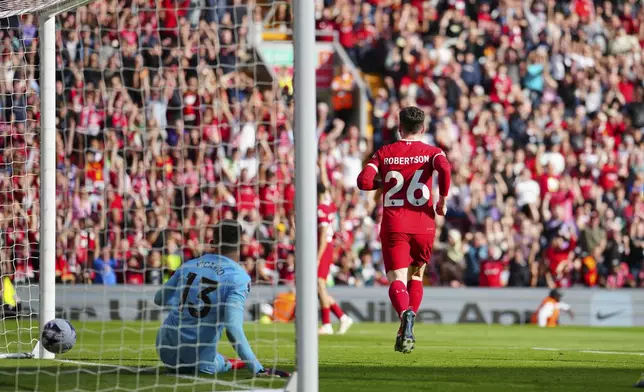 Liverpool's Andrew Robertson celebrates scoring his side's 2nd goal during the English Premier League soccer match between Liverpool and Tottenham Hotspur at Anfield Stadium in Liverpool, England, Sunday, May 5, 2024. (AP Photo/Jon Super)