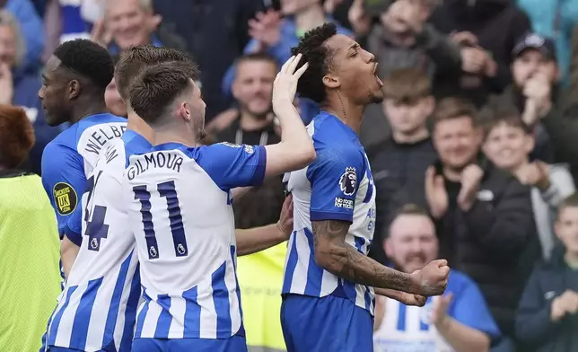 Brighton and Hove Albion's Joao Pedro, right, celebrates after scoring the opening goal of the game during the Premier League match between Brighton &amp; Hove Albion and Aston Villa, at the American Express Stadium in Brighton, England, Sunday May 5, 2024. (Gareth Fuller/PA via AP)
