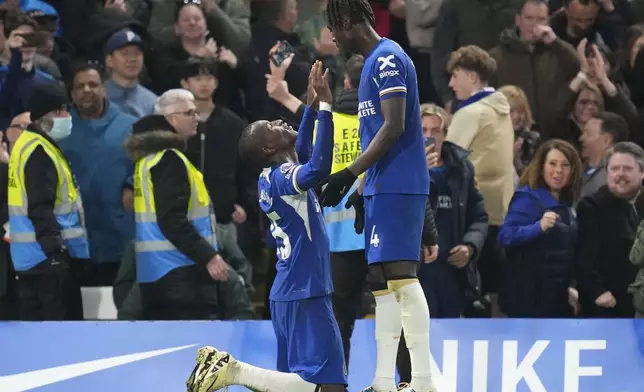 Chelsea's Nicolas Jackson, left, celebrates after scoring his side's second goal during the English Premier League soccer match between Chelsea and Tottenham Hotspur at Stamford Bridge stadium in London, Thursday, May 2, 2024. (AP Photo/Kirsty Wigglesworth)