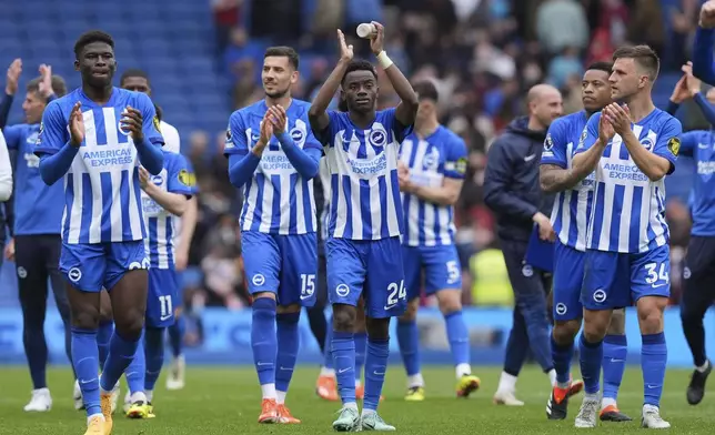 Brighton and Hove Albion players celebrate after winning the Premier League match between Brighton &amp; Hove Albion and Aston Villa, at the American Express Stadium in Brighton, England, Sunday May 5, 2024. (Gareth Fuller/PA via AP)