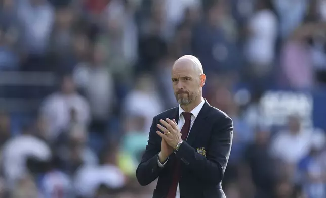 Manchester United manager Erik ten Hag applauds fans, at the end of the English Premier League soccer match between Brighton &amp; Hove Albion and Manchester United, at the Amex Stadium, in Brighton and Hove, England, Sunday, May 19, 2024. (Steven Paston/PA via AP)