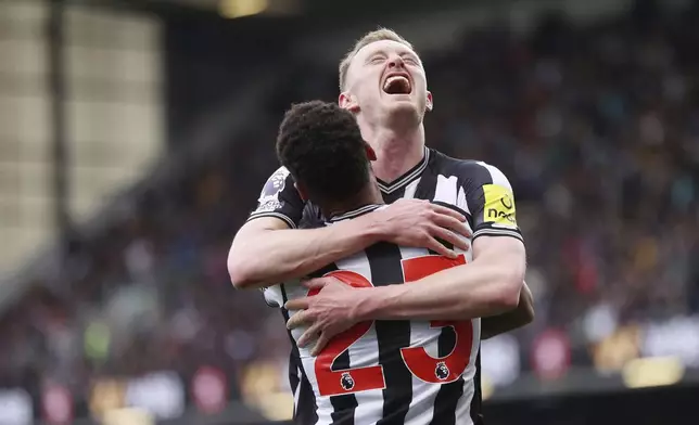 Newcastle United's Sean Longstaff celebrates scoring his side's second goal of the game, during the English Premier League soccer match between Burnley and Newcastle United, at Turf Moor, in Burnley, England, Saturday, May 4, 2024. (Tim Markland/PA via AP)