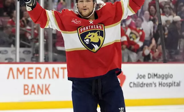 Florida Panthers defenseman Brandon Montour celebrates after Steven Lorentz scored a goal against the Boston Bruins during the second period of Game 2 of a second-round series of the NHL hockey Stanley Cup playoffs Wednesday, May 8, 2024, in Sunrise, Fla. (AP Photo/Lynne Sladky)