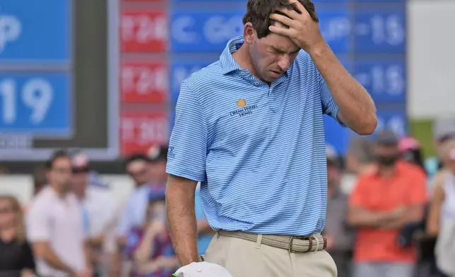 Ben Kohles reactsafter missing a putt on the 18th hole during the final round of the Byron Nelson golf tournament in McKinney, Texas, Sunday, May 5, 2024. (AP Photo/LM Otero)