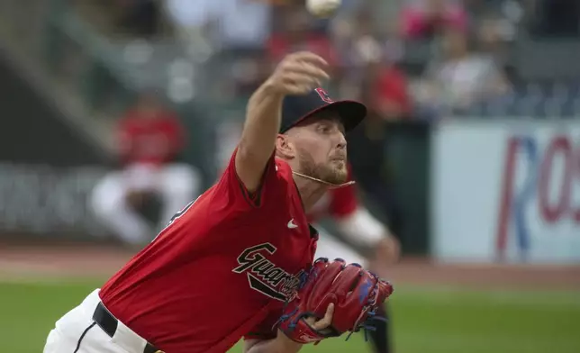 CORRECTS TO LOS ANGELES ANGELS NOT CALIFORNIA ANGELS - Cleveland Guardians starting pitcher Tanner Bibee delivers against the Los Angeles Angels during the first inning of a baseball game in Cleveland, Friday, May 3, 2024. (AP Photo/Phil Long)
