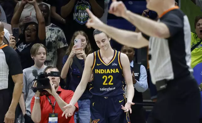 CORRECTS FROM CAITLYN TO CAITLIN - Indiana Fever guard Caitlin Clark (22) reacts after missing a three-point shot as they lose to the Dallas Wings during an WNBA basketball game in Arlington, Texas, Friday, May 3, 2024. (AP Photo/Michael Ainsworth)