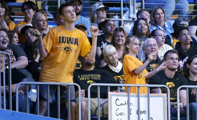 CORRECTS FROM CAITLYN TO CAITLIN - Iowa fans cheer the Indiana Fever and player Caitlin Clark as they play against the Dallas Wings during an WNBA basketball game in Arlington, Texas, Friday, May 3, 2024. (AP Photo/Michael Ainsworth)