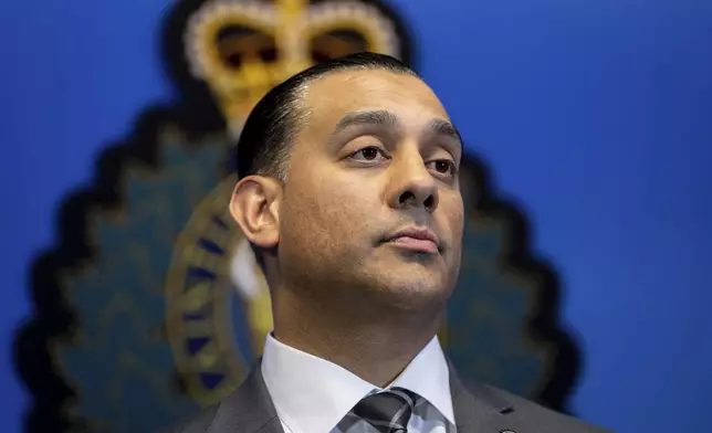 Superintendent Mandeep Mooker, Officer-in-Charge of IHIT listens to questions from media during a news conference for an update on the Hardeep Singh Nijjar homicide investigation from June 18, 2023, in Surrey, B.C., Friday, May 3, 2024. (Ethan Cairns/The Canadian Press via AP)