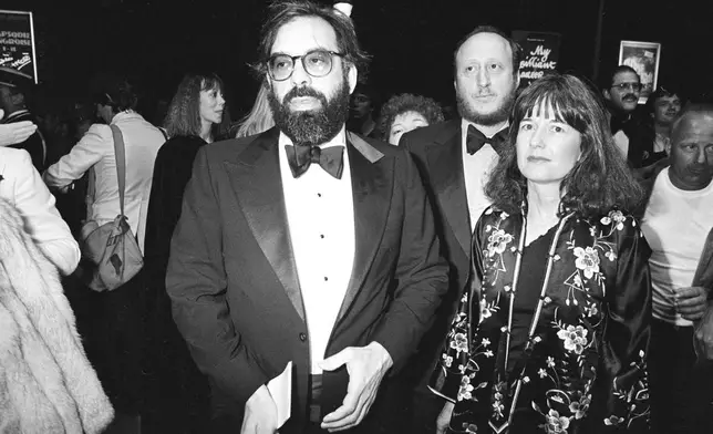 FILE - American director Francis Ford Coppola and his wife, Ellie, arrive for the world premiere of his movie "Apocalypse Now" at the Cannes International Film Festival in the South of France on May 19, 1979. Coppola is back at Cannes with his latest film "Megalopolis." (AP Photo, File)