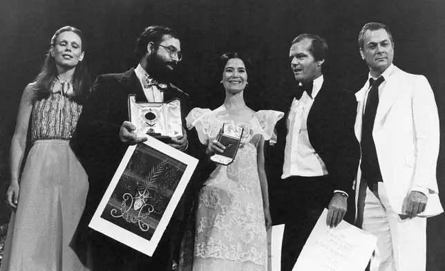 FILE - Swiss actress Marthe Keller, from left, U.S. director Francis Ford Coppola "Gold Palms" winner for his film "The Conversation", Marie-Jose Nat with her prize of Feminine Interpretation, U.S. actor Jack Nicholson, best Men Interpretation and U.S. actor Tony Curtis, after the prize ceremony of the Cannes International Film Festival which ended on May 24, 1974 in Cannes, France. Coppola is back at Cannes with his latest film "Megalopolis." (AP Photo/Jean-Jacques Levy, File)