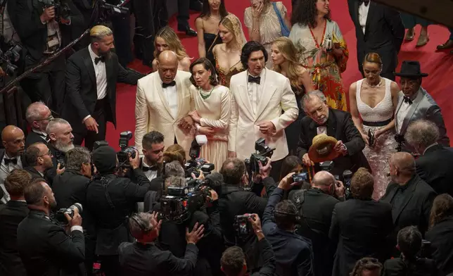 Shia LaBeouf, from left, Laurence Fishburne, Aubrey Plaza, Adam Driver, director Francis Ford Coppola, Nathalie Emmanuel and Giancarlo Esposito pose for photographers upon departure from the premiere of the film 'Megalopolis' at the 77th international film festival, Cannes, southern France, Thursday, May 16, 2024. (Photo by Andreea Alexandru/Invision/AP)