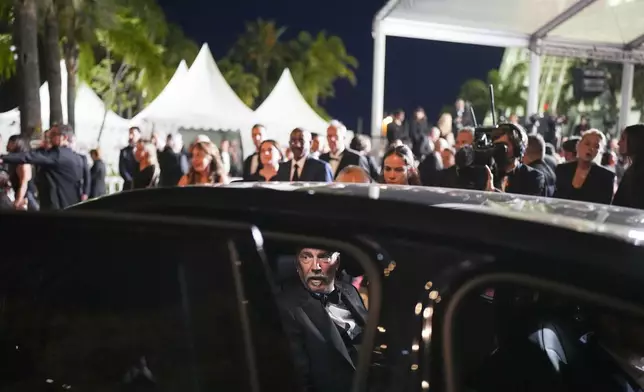 Kevin Costner sits in a car upon departure from the premiere of the film 'Horizon: An American Saga' at the 77th international film festival, Cannes, southern France, Sunday, May 19, 2024. (Photo by Daniel Cole/Invision/AP)
