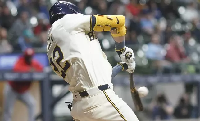 Milwaukee Brewers' Christian Yelich hits an RBI triple during the fifth inning of a baseball game against the St. Louis Cardinals Thursday, May 9, 2024, in Milwaukee. (AP Photo/Morry Gash)