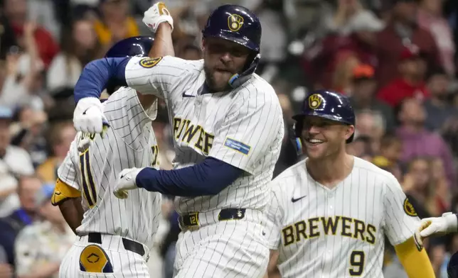 Milwaukee Brewers' Rhys Hoskins celegrates his three-run home run during the seventh inning of a baseball game against the St. Louis Cardinals Saturday, May 11, 2024, in Milwaukee. (AP Photo/Morry Gash)