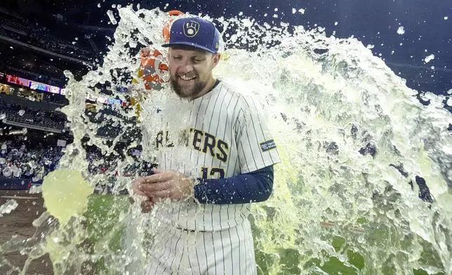 Milwaukee Brewers' Rhys Hoskins is douced after a baseball game against the St. Louis Cardinals Saturday, May 11, 2024, in Milwaukee. The Brewers won 5-3. (AP Photo/Morry Gash)