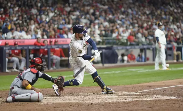 Milwaukee Brewers' Rhys Hoskins hits a three run home run during the seventh inning of a baseball game against the St. Louis Cardinals Saturday, May 11, 2024, in Milwaukee. (AP Photo/Morry Gash)