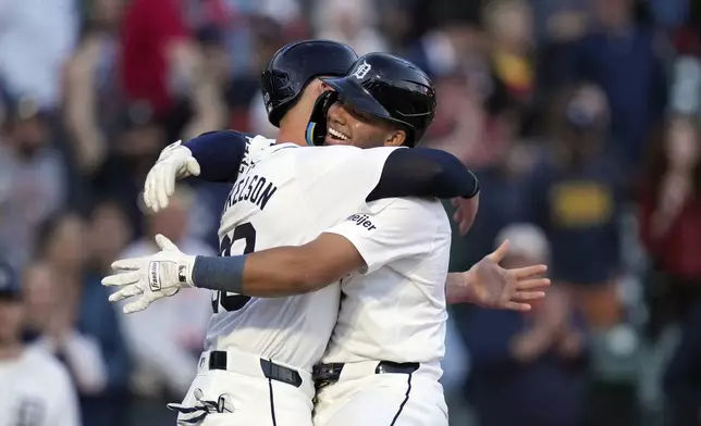 Detroit Tigers' Wenceel Pérez is greeted by Spencer Torkelson after hitting a two-run home run during the fifth inning in the second game of a baseball doubleheader against the St. Louis Cardinals, Tuesday, April 30, 2024, in Detroit. (AP Photo/Carlos Osorio)
