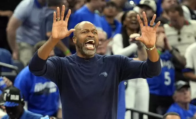 Orlando Magic head coach Jamahl Mosley directs his players on the court during the first half of Game 6 of an NBA basketball first-round playoff series against the Cleveland Cavaliers, Friday, May 3, 2024, in Orlando, Fla. (AP Photo/John Raoux)