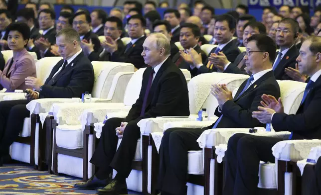 Russian President Vladimir Putin, center, and Chinese Vice President Han Zheng, right, attend the opening ceremony of the Russian-Chinese EXPO and Russian-Chinese Forum on Interregional Cooperation in Harbin in northeastern China's Heilongjiang Province, on Friday, May 17, 2024. (Mikhail Metzel, Sputnik, Kremlin Pool Photo via AP)