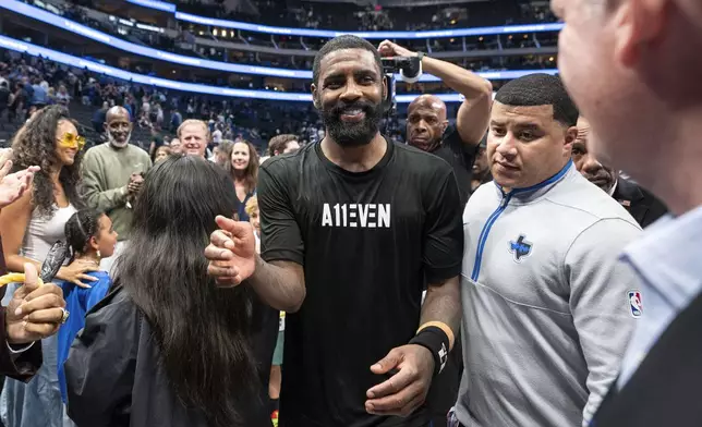 Dallas Mavericks' Kyrie Irving leaves the court after beating the Los Angeles Clippers 114-101 in Game 6 of an NBA basketball first-round playoff series Friday, May 3, 2024, in Dallas. (AP Photo/Jeffrey McWhorter)
