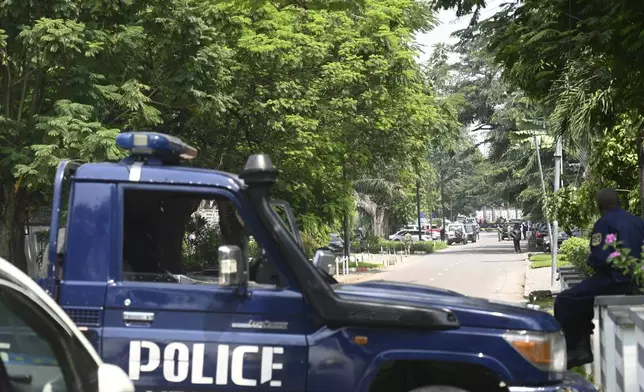 Congolese security forces secure the streets of Kinshasa, Democratic Republic of Congo, on Sunday May 19, 2024, after Congo's army said it has "foiled a coup" and arrested the perpetrators, including several foreigners, following a shootout between armed men in military uniform and guards of a close ally of Congo's president that left three people dead in the capital, Kinshasa. (AP Photo/Samy Ntumba Shambuyi)